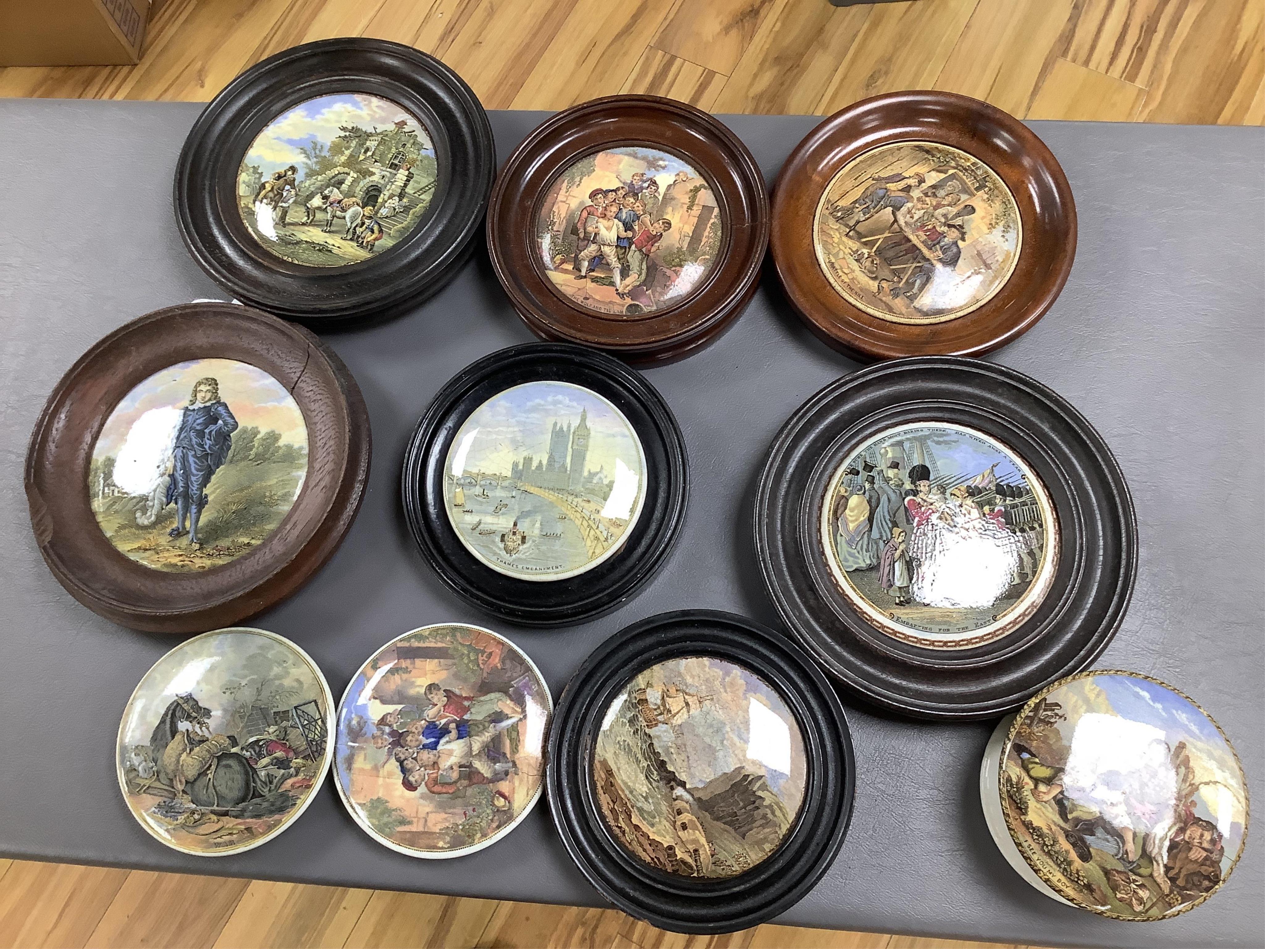 A group of ten pot lids and two related books